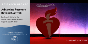 A large red torch heart logo stands on stage with purple lighting at the International Stroke Conference. Text at left promotes a February 5, 2026 research update on mental health and peer support by The Bee Foundation.