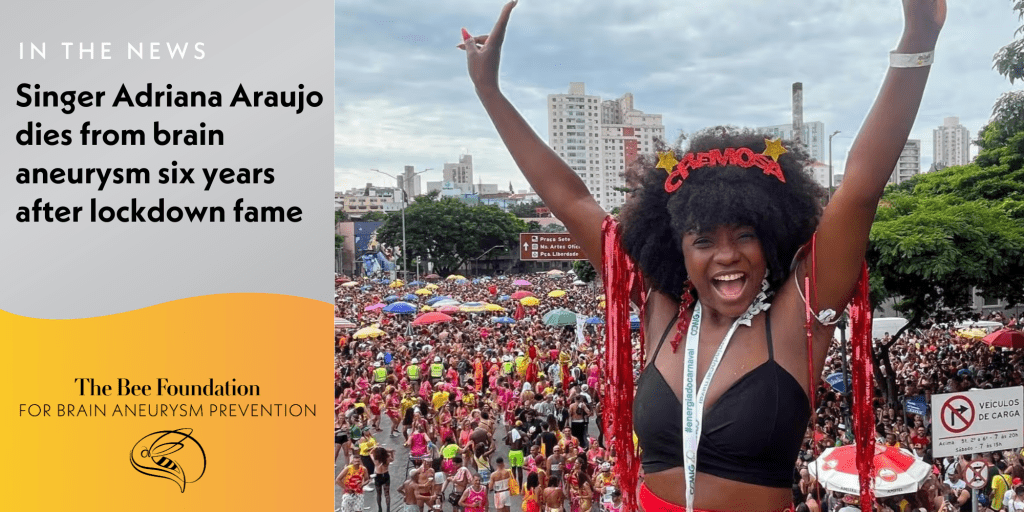 A woman in a festive costume with arms raised smiles at a colorful outdoor carnival, with a large crowd and city buildings in the background. Text reports her death from a brain aneurysm six years after lockdown fame.