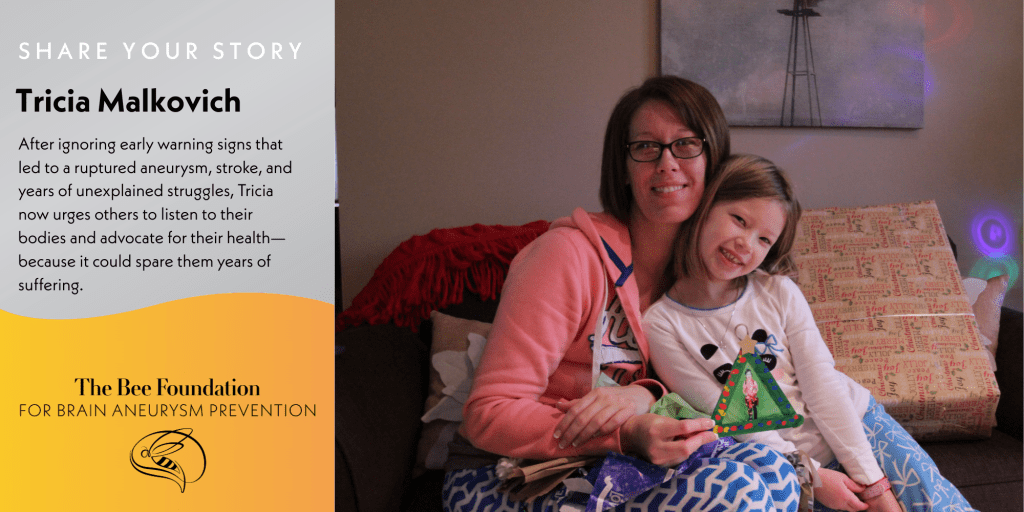 A woman and young girl sit smiling on a couch. The woman holds the child on her lap. A banner reads: “The Bee Foundation for Brain Aneurysm Prevention,” with text sharing Tricia Malkovichs story of warning signs and advocacy.