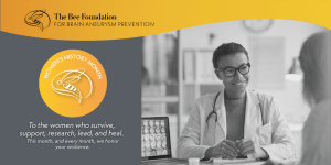 A female doctor smiles at a patient in an exam room, with brain scans visible on a monitor. The Bee Foundation logo and a Womens History Month badge appear, honoring women in brain aneurysm prevention and care.